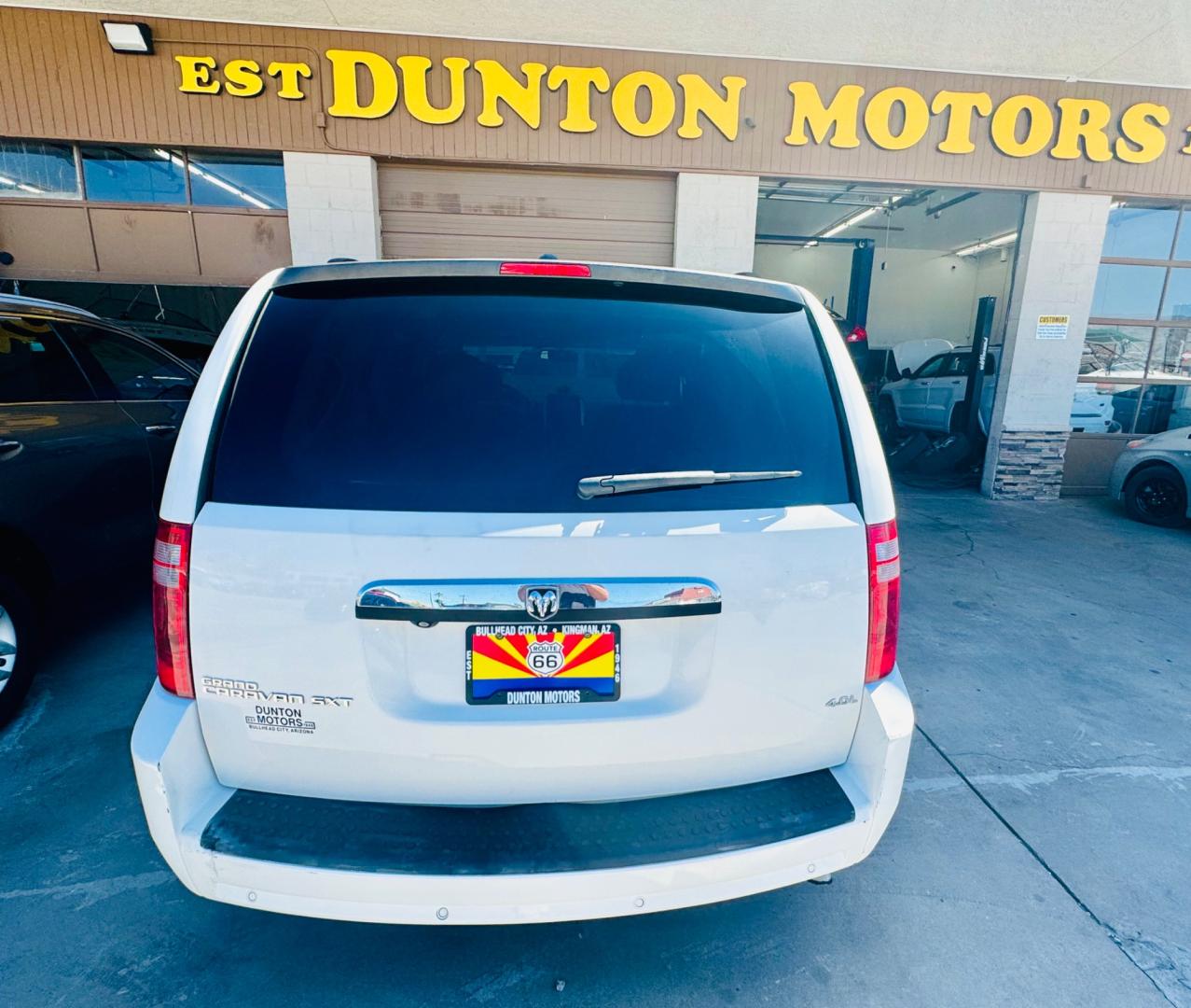 2008 White /black Dodge Caravan (2D8HN54XX8R) , located at 2190 Hwy 95, Bullhead City, AZ, 86442, (928) 704-0060, 0.000000, 0.000000 - 2008 Dodge caravan SXt. leather loaded, backup camera, bluetooth, satellite radio, rear tv,dvd player. moonroof. stow and go seating. seating for 7. rear folds down for bed. has table . free Carfax , free warranty. - Photo#1